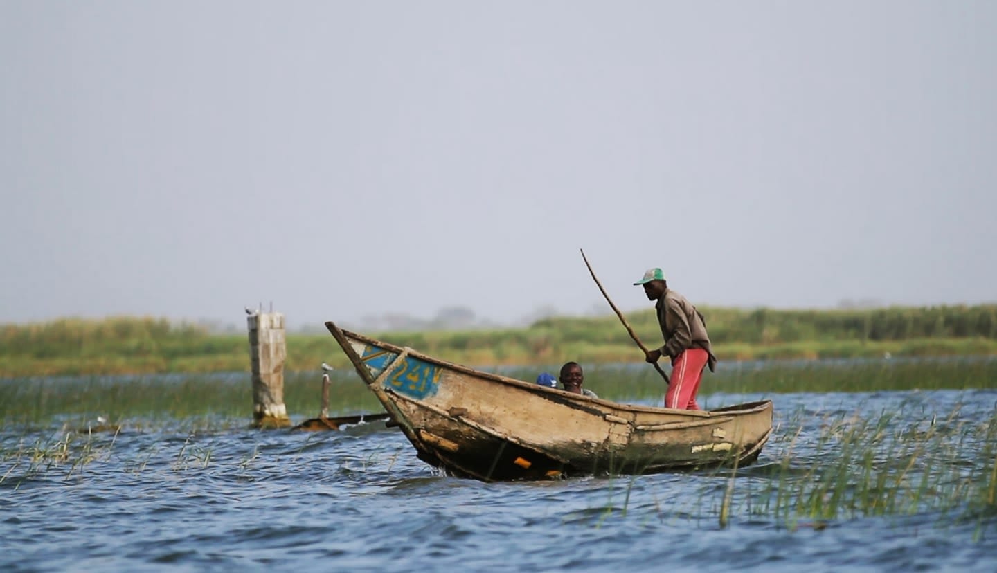 Fisherman navigating on the water in the Democratic Republic of the Congo
