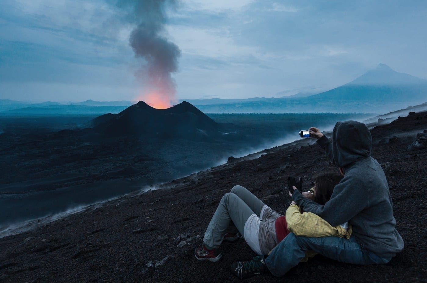 Nyamulagira volcano eruption being watched by guests