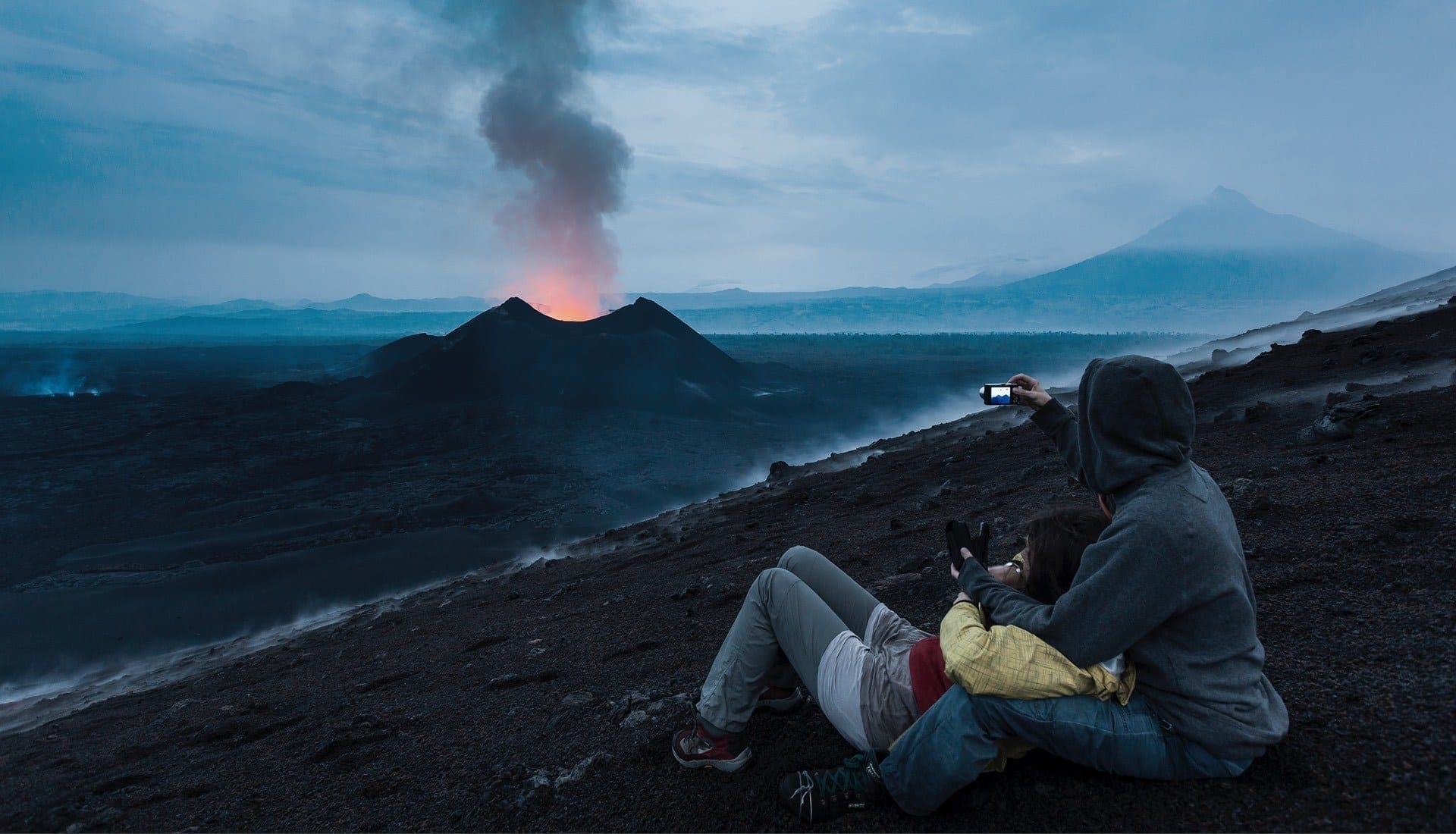 Nyamulagira volcano eruption being watched by guests