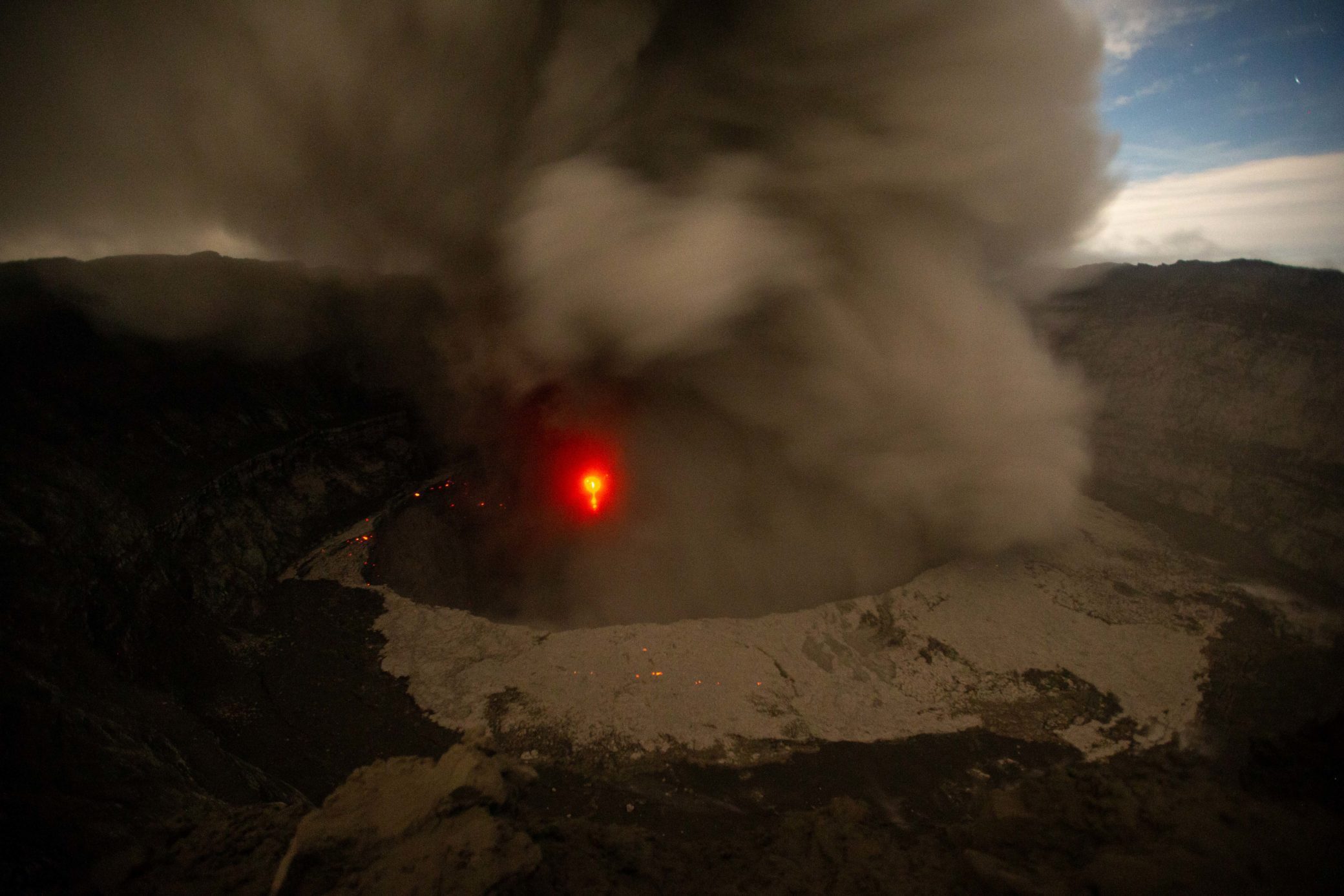 Mt Nyiragongo eruption in 2021 showing ash around the crater by photographer Christopher Horsley